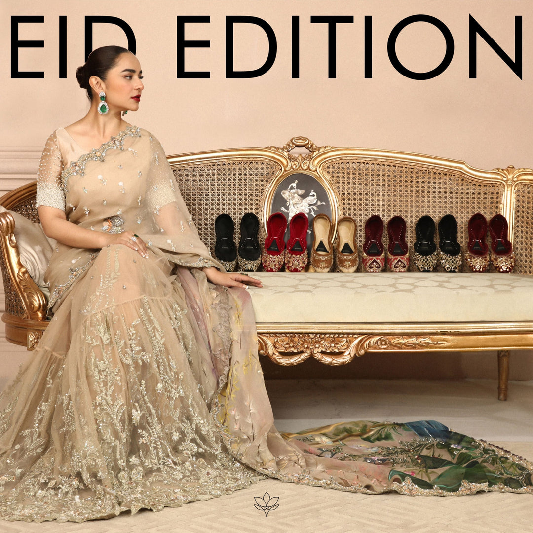 Woman in embellished dress on ornate sofa beside assorted women's khussa shoes, Eid Edition