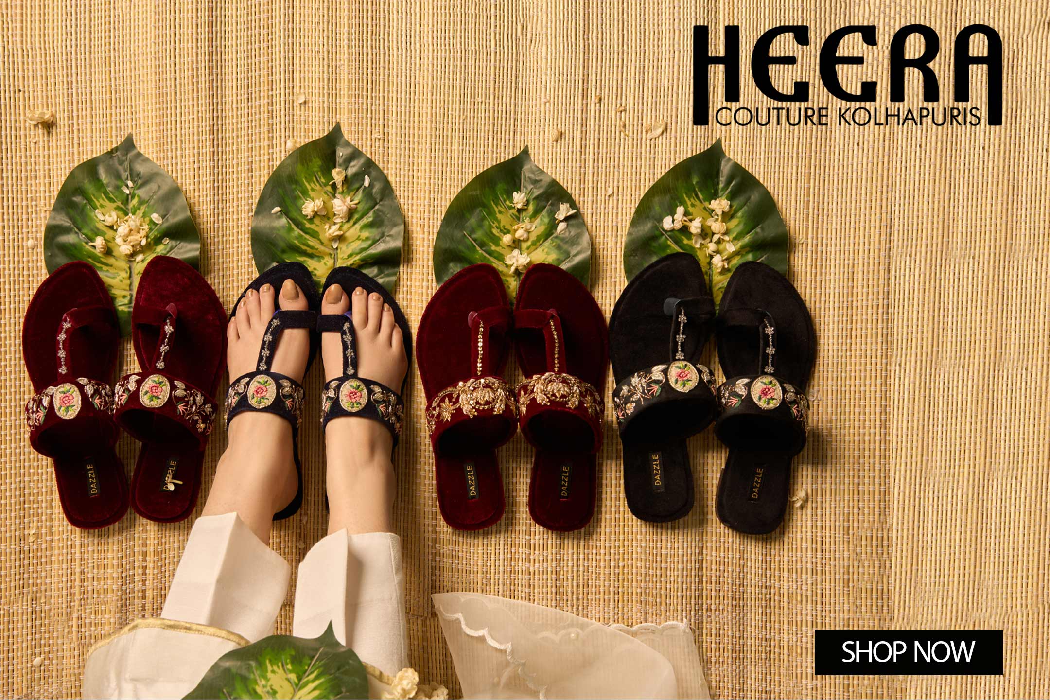 Embroidered Kolhapuri sandals for women displayed on a mat with floral details.